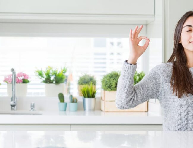 Relaxed woman practicing calm breathing before a colonic session as part of pre colonic diet preparation