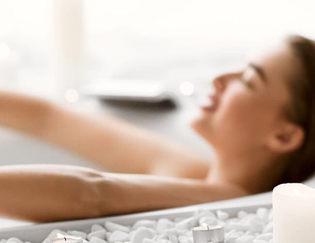 Client relaxing during PEMF therapy in Tempe before or after a colon hydrotherapy session at Amber Colonics.